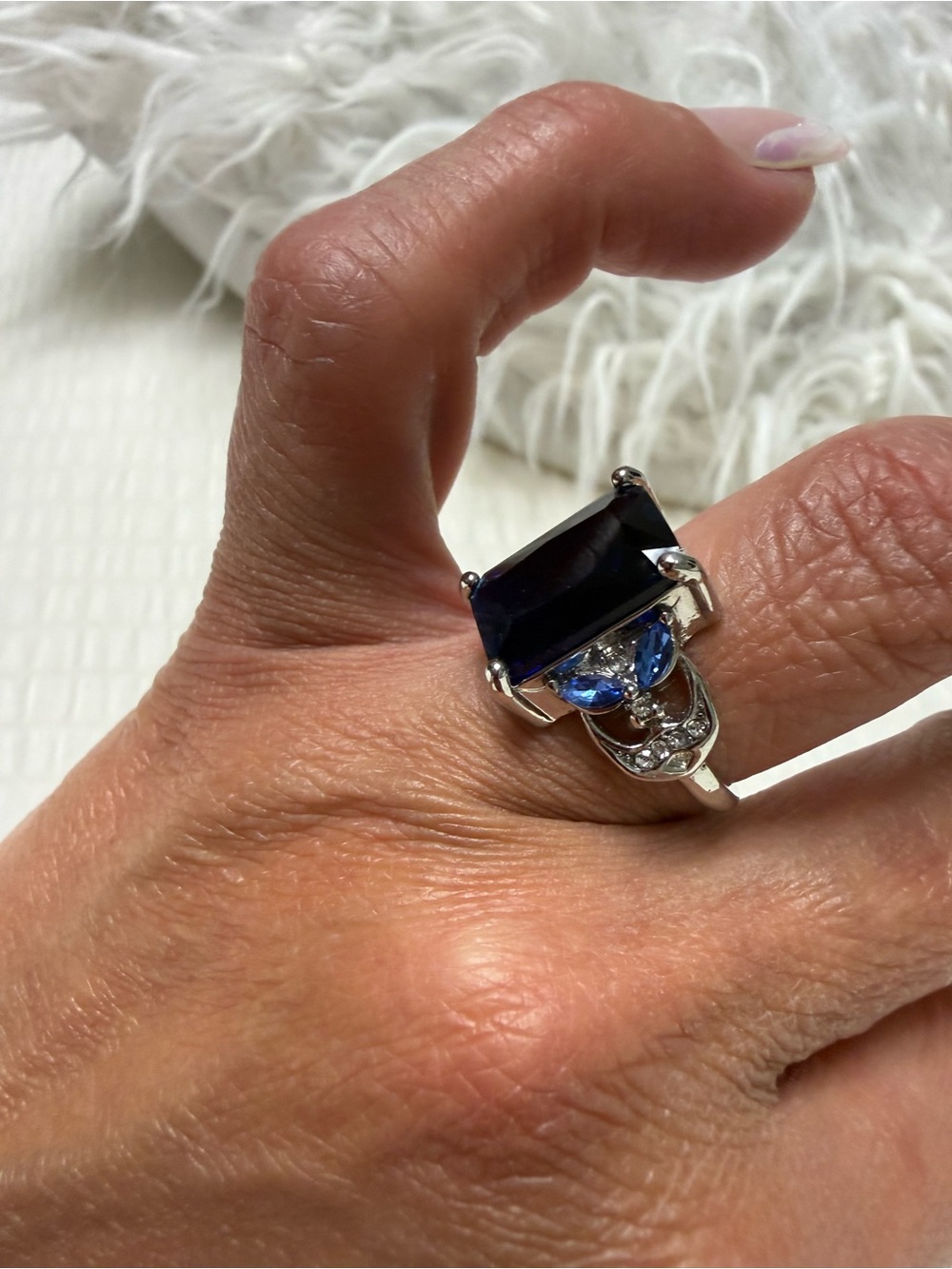 Silver Ring with Dark Blue Center Stone and Light Blue Accents